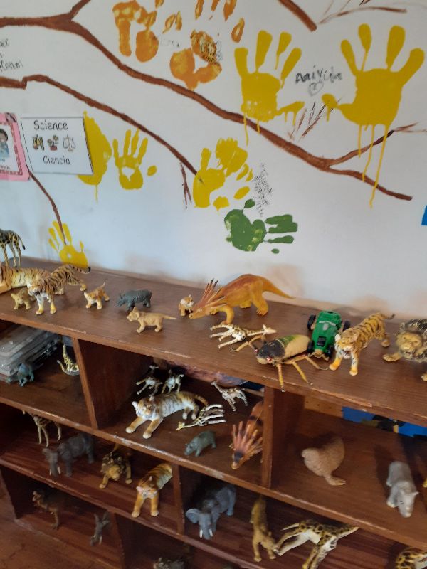 Children engaged in interactive learning experiences that combine play and education at Daily Bread Child Care Development Center