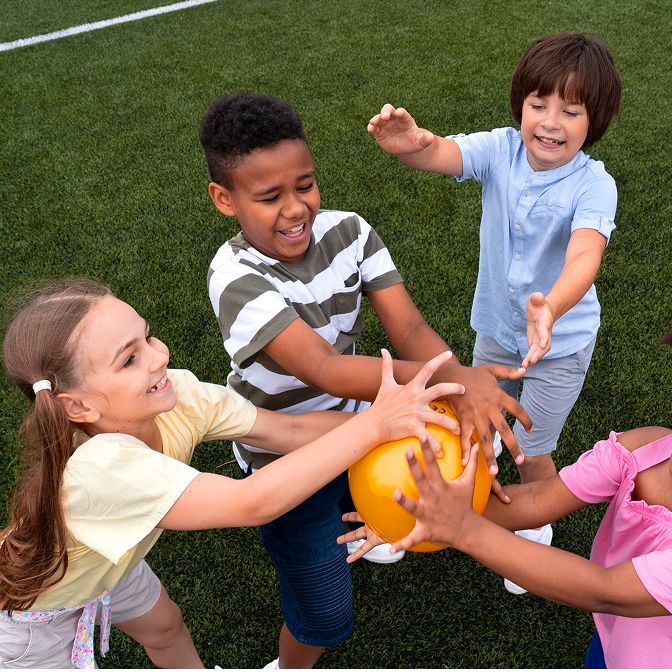 Group of happy toddlers playing together in a colorful, safe classroom environment at Daily Bread Child Care Development Center in Laurinburg, NC